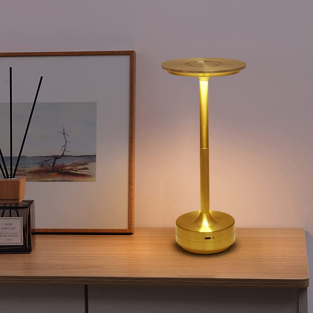 Sophisticated gold LED cordless table lamp with wireless design for elegant home illumination